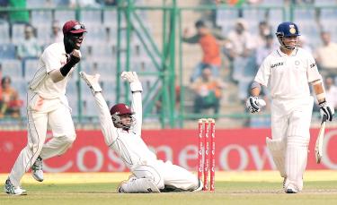 ... Sachin Tendulkar, right, on the fourth day of the first Test between