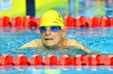 Australian nearing 100 sets record at Games swim trials