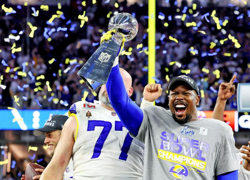 rams holding the trophy