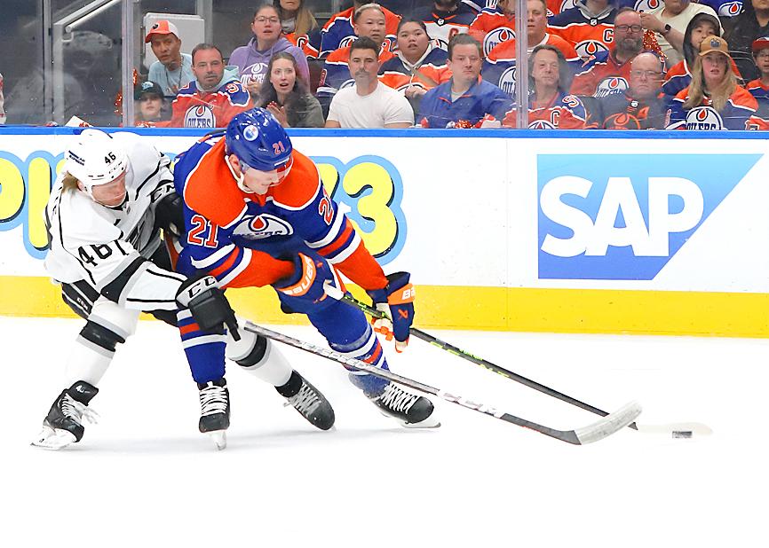 Oilers fans takes a beating in the stand at the Rogers Arena