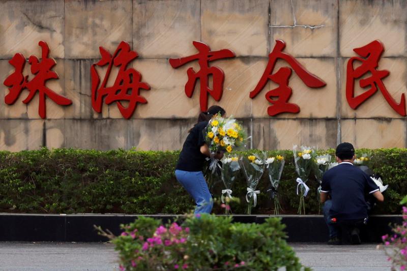 China clears car attack memorial as government scrambles to respond
