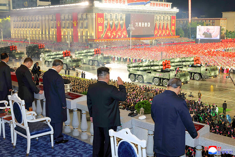 N Korea parades ballistic missiles